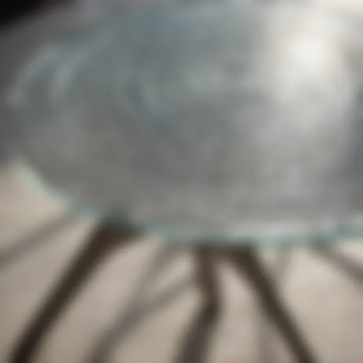 Close-up view of the intricate design of a glass tabletop with reflections in sunlight