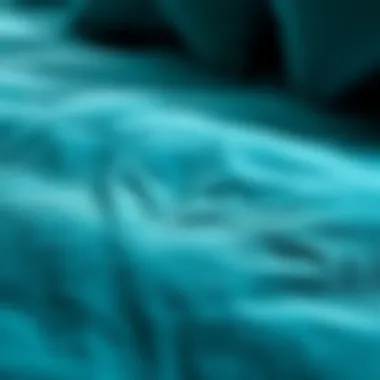 Close-up of the fabric texture of a teal queen comforter