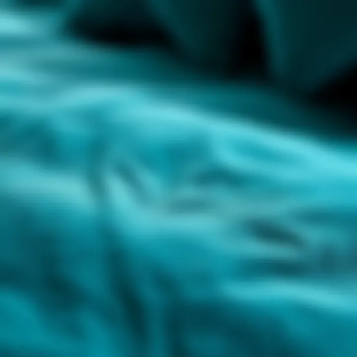 Close-up of the fabric texture of a teal queen comforter